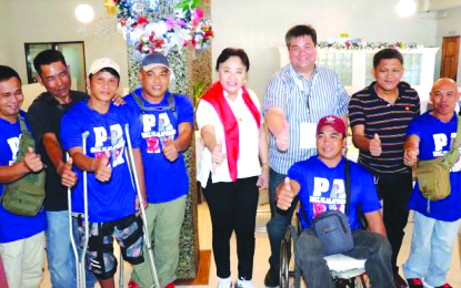 National sitting volleyball players from Negros Occidental Commission on Elections Commissioner Rowena Guanzon (center) and Silay City Mayor Mark Golez (3rd from right) with some of the national sitting volleyball players from Negros Occidental. MARK GOLEZ
