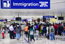 Passengers wear face masks at the Ninoy Aquino International Airport Terminal 1 in Parañaque City, as the country heightened its measures to combat the spread of the new coronavirus strain from Wuhan, China. MARK DEMAYO/ABS-CBN NEWS