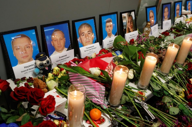 Protests spark after Iran admits downing Ukrainian plane Flowers and candles are placed in front of the portraits of the flight crew members of the Ukraine International Airlines Boeing 737-800 plane that crashed in Iran, at a memorial at the Boryspil International airport outside Kiev, Ukraine on Jan. 11. REUTERS/VALENTYN OGIRENKO