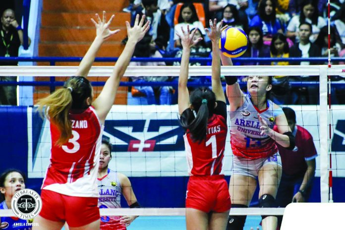 Regine Arocha Arellano University Lady Chiefs’ Regine Arocha scores against a San Beda University Lady Red Spikers defender. TIEBREAKER TIMES PHOTO
