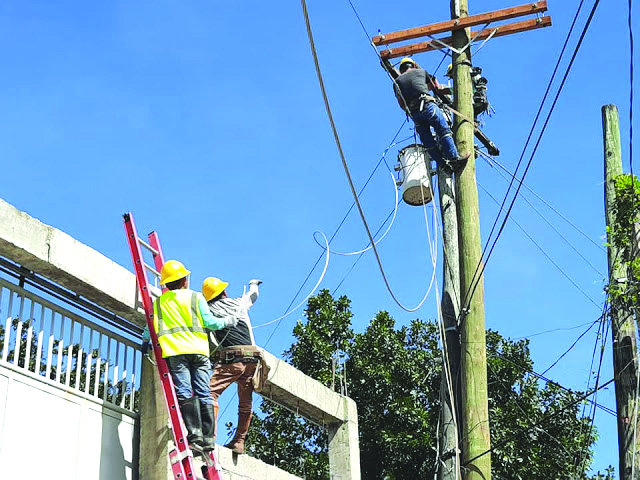 Region-Aklan Linemen of Task Force Kapatid Ursula fix electric poles to restore electricity in the affected areas of Aklan and Antique. AKELCO PHOTO