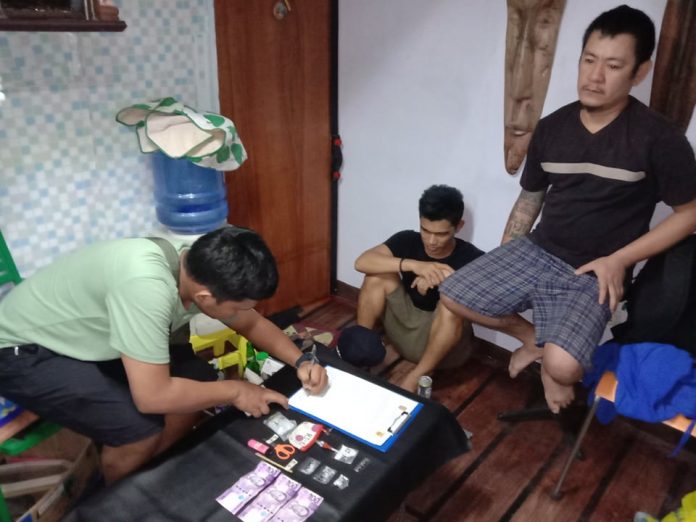Rish Ivan Javier and Ryan Libre An antidrug officer inspects the items seized from drug suspects Rish Ivan Javier and Ryan Libre during an entrapment operation in Barangay 1, Bacolod City on Jan. 29. POLICE STATION 2/BCPO
