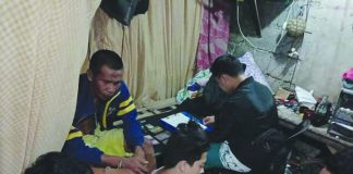 Antidrug officer inspect items seized from Roberto Cerillo, Choe Demerin and Jan Rey Pabon. The suspects were nabbed in an entrapment operation in in Barangay Vista Alegre, Bacolod City. POLICE STATION 2/BCPO