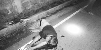 Rolanda Pineda lies dead on the road after his driven motorcycle crashed against a truck in Barangay Granada, Bacolod City on Jan 20. POLICE STATION 5/BCPO