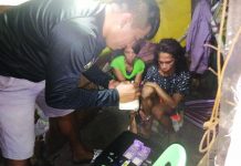 Siblings fall in buy-bust An antidrug officer inspects the recovered items seized from drug suspects Rovilma Besañes and Romeo Mahilum during an entrapment operation in Barangay 22, Bacolod City on Jan. 9. POLICE STATION 6/ BCPO