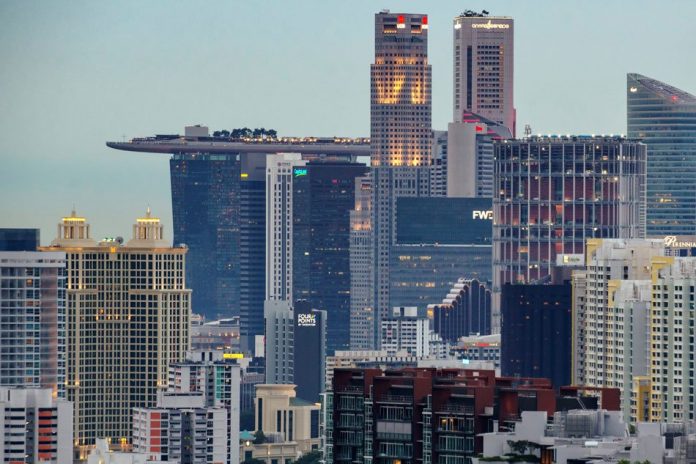 Singapore An aerial view shows commercial and residential buildings in central Singapore. Singapore’s economy, a closely watched barometer for the rest of Asia’s export-driven countries, grew just .7 percent last year as the trade war between United States and China hammered global markets. REUTERS
