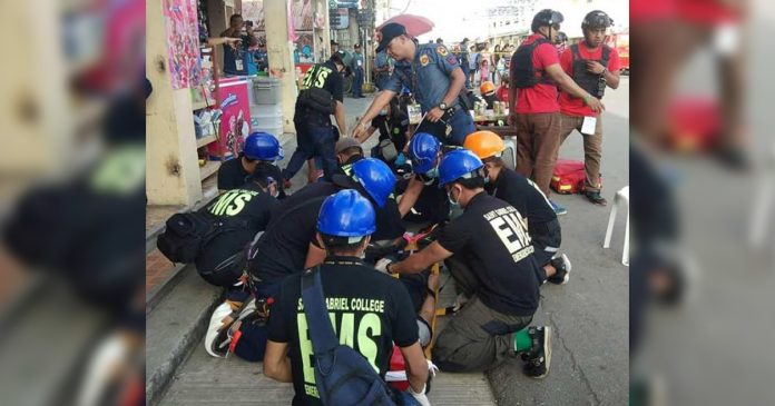 A police officer and emergency rescuers assist a victim during a shooting simulation exercise in Kalibo, Aklan on Jan. 13 as preparation for the upcoming Ati-Atihan Festival. PHOTO KALIBO PNP