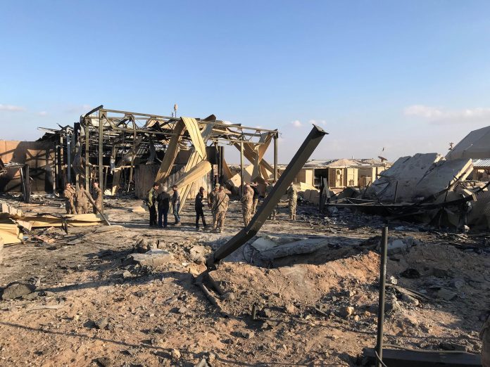 United States soldiers inspect the site where an Iranian missile hit an air base in Anbar province, Iraq on Jan. 13. REUTERS/ JOHN DAVISON