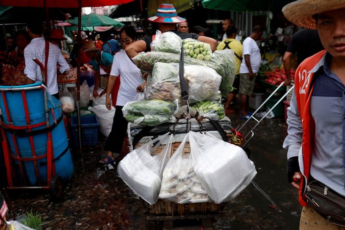 Vegetables Vegetables are carried in plastics bags at a market in Bangkok, Thailand. REUTERS