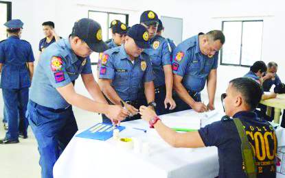 Some of the 102 personnel of the Negros Occidental Police Provincial Office who underwent a surprise drug test on Jan. 13. PNA