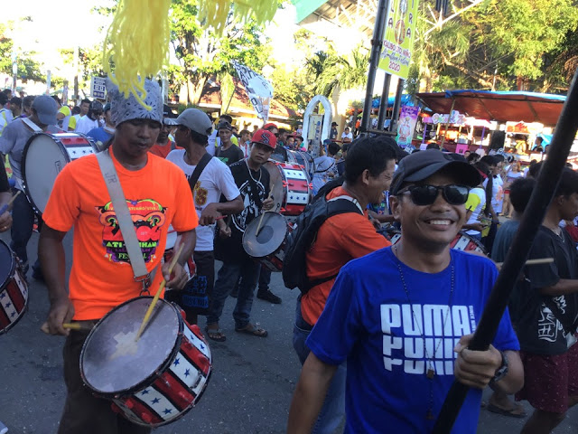 Revelers bring drums and banners to celebrate the Ati-Atihan Festival. For security measures, authorities plan a signal shutdown in some areas near and within the zone of the festival today. AKEAN FORUM