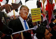 Rockets hit US embassy in Baghdad amid protests Demonstrators are seen carrying an image of United States (US) President Donald Trump during a protest aimed at pressuring US troops to leave Iraq. REUTERS