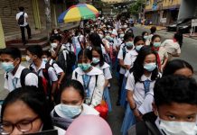 No classes in Iloilo City for 2 weeks Students wearing protective masks during a school activity in Manila. AP