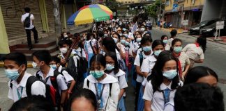 Students wearing protective masks during a school activity in Manila. AP