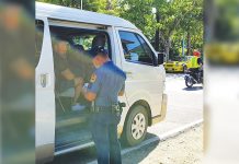 Personnel of the Malay municipal police station flag down this vehicle at a border control checkpoint here. The local government unit put up checkpoints in the boundaries of the town to lessen the risk of spreading the corona virus disease 2019 (COVID-19). MALAY AKLAN PNP