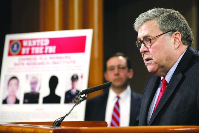Attorney General William Barr Attorney General William Barr speaks during a news conference, Monday, Feb. 10, 2020, at the Justice Department in Washington, as Principal Associate Deputy Attorney General Seth Ducharm looks on. AP