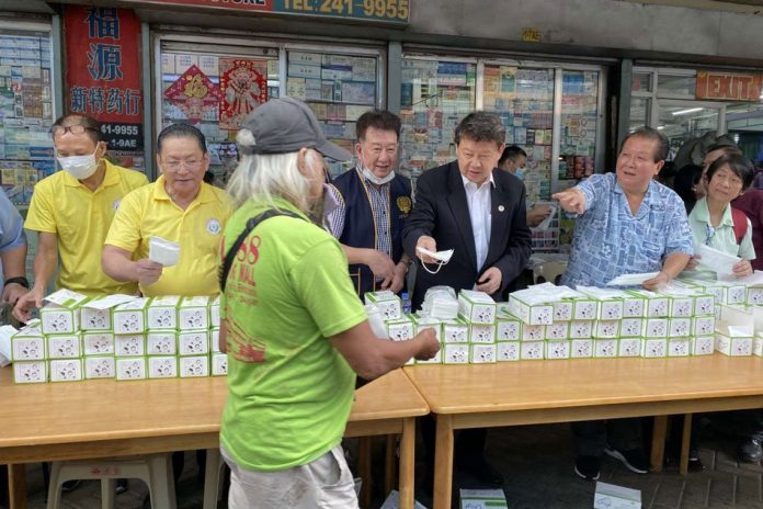 Filipino-Chinese chambers Members of the Federation of Filipino Chinese Chambers of Commerce and Industries Incorporated (FFCCCII) give out free face masks to passersby at the Binondo District in Manila, Thursday. ABS-CBN NEWS