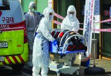 WHO warns of pandemic risk after virus peaks in China Employees from a disinfection service company sanitize the floor of a shopping center in Daejeon, South Korea, Feb. 22, 2020. REUTERS