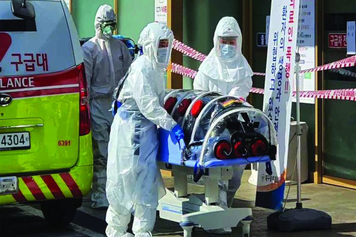 Coronavirus Employees from a disinfection service company sanitize the floor of a shopping center in Daejeon, South Korea, Feb. 22, 2020. REUTERS