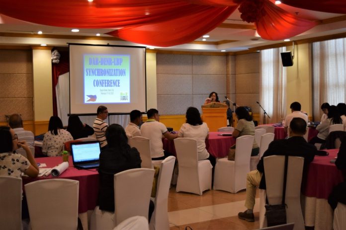 Assistant regional director Lucrecia S. Taberna welcoming the guests and participants during the 2-day DAR-DENR-LBP Synchronization Conference held on Feb. 17-18, 2020 at the Days Hotel, Iloilo City.