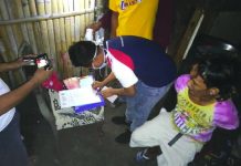 Drug suspect falls in sting op An antidrug officer inspects items seized from Darwin Tabotabo during an entrapment operation in Barangay 19, Bacolod City on Feb. 3. POLICE STATION 9/BCPO