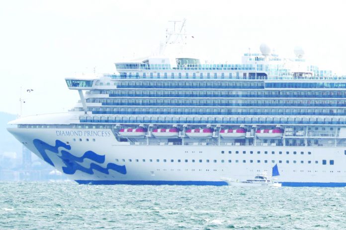 The 'Diamond Princess' cruise ship sits anchored in quarantine off the port of Yokohama, Japan, on Feb. 4, 2020. The 20 people on board who have been infected consist of one Filipino crew member, three Americans, two Australians, seven Japanese, one from Taiwan, two Canadians, one New Zealander, and three from Hong Kong. They have been taken to local hospitals. AFP