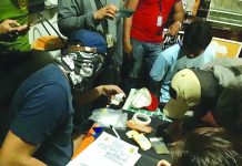 Student caught ‘selling marijuana’ Antidrug officers inspect items seized from Jerenz Abuel. He was nabbed in an entrapment operation in Barangay Poblacion, Kalibo Aklan on Feb. 18. BOY RYAN ZABAL/PN