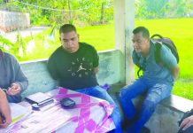Antidrug officers inspect items seized from Junny Cris Delonguines and Lord Rubias. They were caught in an entrapment operation outside the Aklan Rehabilitation Center in Barangay Nalook on Feb. 8. RODNEL AGUIRRE