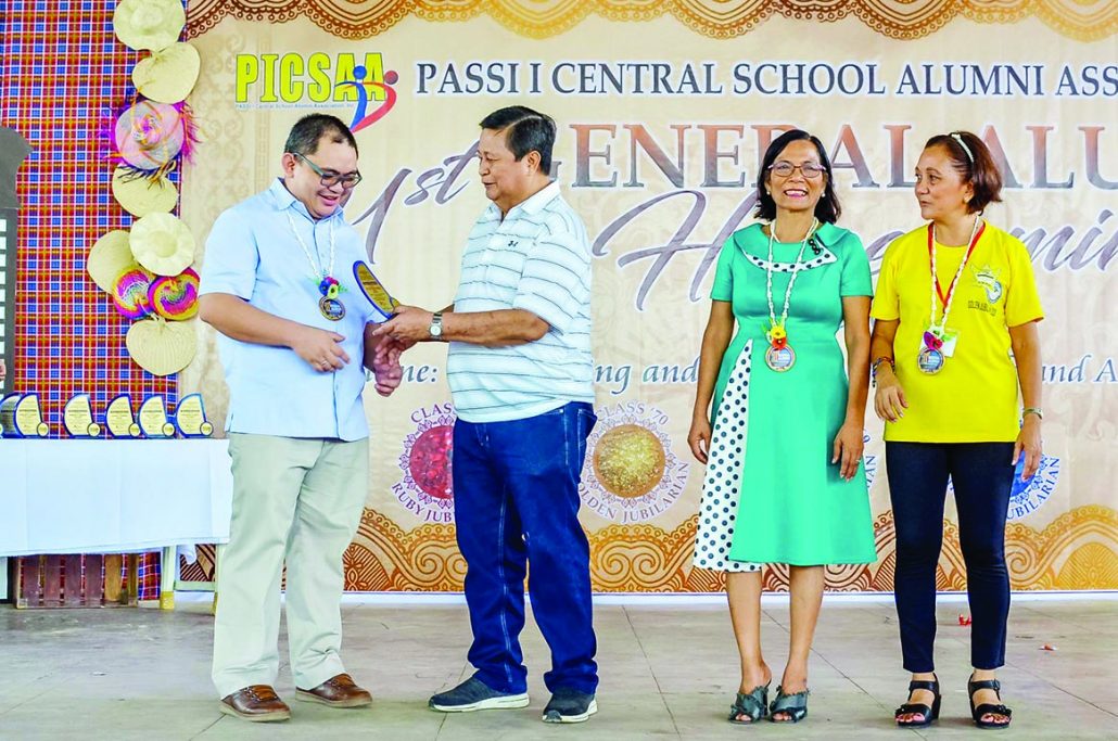 Rev. Fr. Yves Francis Daquiado Martinez receives plaque of recognition as one of the Outstanding Alumni from PCSAA Inc. consultant Dr. Raymundo Lapating, PICS Principal III Mrs. Evelyn Villanueva, and PCSAA Inc. president Mrs. Carmelita Burman.