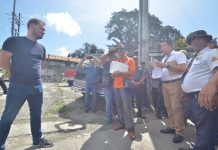 ‘Shocked’ PECO challenges takeover, seeks legal remedies Panay Electric Co. administrative manager Marcelo Cacho (left) refuses to receive from court sheriffs the Writ of Possession issued by the court. IAN PAUL CORDERO/PN