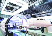Singapore bank clears office after virus case found A static model of a Mitsubishi Aircraft Spacejet sits on display at the Singapore Airshow on Tuesday, Feb. 11, 2020, in Singapore. AP