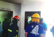 These firefighters are making sure they have completely put out the fire that hit the police station in Molo, Iloilo City on Feb. 3. IAN PAUL CORDERO/PN
