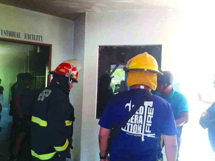 Molo, Iloilo City Fire These firefighters are making sure they have completely put out the fire that hit the police station in Molo, Iloilo City on Feb. 3. IAN PAUL CORDERO/PN
