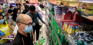 People hoard bottles of alcohol after the Philippine government confirmed the first case of the new coronavirus in the country, in Makati City. PBS