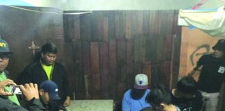 Antidrug personnel inspect items seized from Ritchie Manday, Nevin Gabines, Felomino Cordova and John Michael Shiung. The suspects were nabbed in an entrapment operation in Barangay Estefania, Bacolod City on Feb. 19. CDEU/BCPO