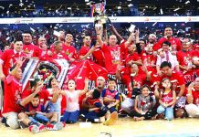San Miguel Corporation sports director Alfrancis Chua (raising both arms) celebrates the championship of the Barangay Ginebra Kings durin the 2019 Philippine Basketball Association Governors’ Cup Finals. PBA