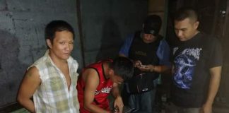 An antidrug officer inspects the items seized from drug suspect Sebastian Lo during an entrapment operation in Barangay 27, Bacolod City on Feb. 6. POLICE STATION 4/BCPO