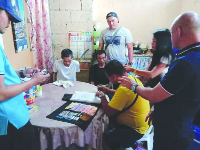 Segundo Iglesia Jr., Jeronimo Demafelis and Rosalin Iglesia Antidrug officers inspect items seized from drug suspects Segundo Iglesia Jr., Jeronimo Demafelis and Rosalin Iglesia. They were nabbed in an entrapment operation in Barangay Villamonte, Bacolod City on Feb. 27. POLICE STATION 4/BCPO