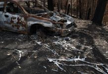 State of emergency declared as bushfire threatens Canberra Melted metal from a vehicle destroyed in the recent bushfires is pictured in Conjola Park, New South Wales, Australia on Jan. 21. REUTERS/LOREN ELLIOTT