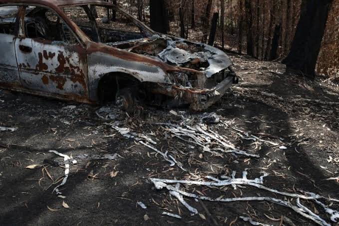 State of emergency declared as bushfire threatens Canberra Melted metal from a vehicle destroyed in the recent bushfires is pictured in Conjola Park, New South Wales, Australia on Jan. 21. REUTERS/LOREN ELLIOTT