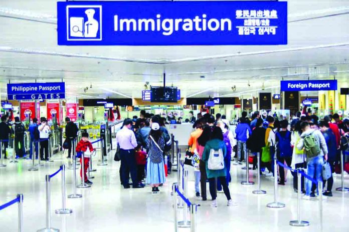 Travel Ban Passengers arriving at the Ninoy Aquino International Airport Terminal 1 in Parañaque City wear face masks as a precaution. President Rodrigo Duterte has expanded the ban on travelers to and from mainland China, Hong Kong, and Macau. ABS-CBN NEWS