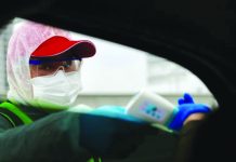 First American dies of novel coronavirus in China A worker takes body temperature measurement of a passenger inside a vehicle following an outbreak of the novel coronavirus in Wuhan, Hubei province, China Feb. 7, 2020. CHINA DAILY REUTERS