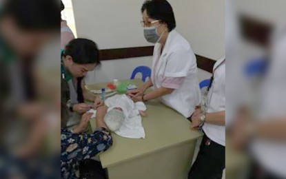 region-antique Cheyfrah Rumbines, a 20-day-old baby with a respiratory problem, avails her free laboratory tests at the Angel Salazar Memorial General Hospital in Antique last Jan.30. PIO ANTIQUE