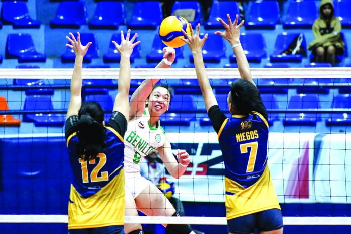 sports-volleyball College of St. Benilde Lady Blazers’ Mycah Go scores against two Jose Rizal University Lady Bombers defenders. TIEBREAKER TIMES