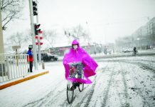 Coronavirus infections in China rise after 2-day decline This woman wearing a facemask rides a bicycle amid snow, as China is threaten by an outbreak of the novel coronavirus. REUTERS