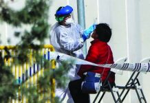 Spain’s virus death toll surpasses China’s A doctor checks a woman in Madrid. Spain now has more than 47,000 confirmed cases of COVID-19. GETTY IMAGES