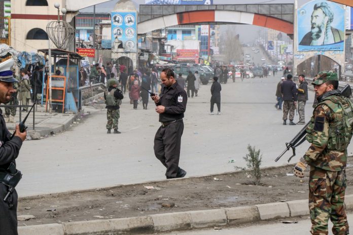 Afghan security forces personnel stand guard on a road near the site of a gun attack in Kabul March 6, 2020. AFP Afghan security forces personnel stand guard on a road near the site of a gun attack in Kabul March 6, 2020. AFP