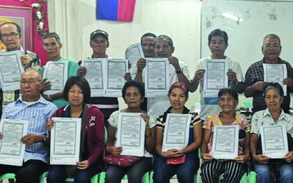 Agrarian reform beneficiaries Some of the 19 agrarian reform beneficiaries receive certificate of land ownership awards to around 55 hectares of redocumented land in Barangay Felisa, Bacolod City on March 5. DAR NEGROS OCCIDENTAL I-NORTH