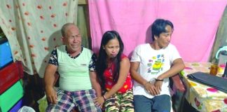 Drug suspects Armando Galgarin, Raquel Galgarin and Arlie Galgarin sit down while antidrug personnel inspect items seized from them during an entrapment operation in Barangay Banago, Bacolod City on March 12. POLICE STATION 2