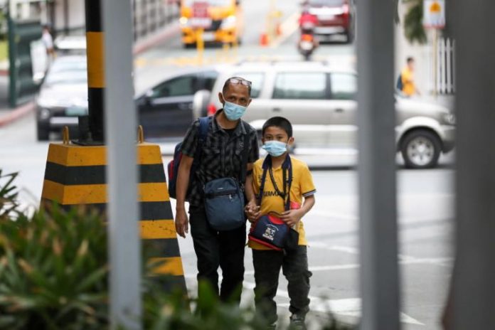 COVID-19 cases in PH rise to 33 A man and a child wearing masks at Greenhills district in Manila, Philippines, on March 6, 2020. EPA-EFE